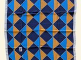 a blue, orange and yellow square scarf on a white background