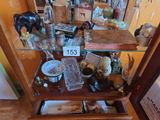 a glass display case with a lot of items on it