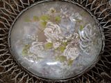 a picture of a glass plate with flowers on it