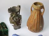 three different vases and one is blue and one is brown