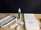 a toothbrush, toothpaste, and other items on a table