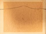 an old book with a drawing of a wave on it