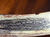 a close up of a piece of wood on a table