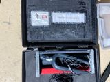 a black case with wires in it sitting on the floor