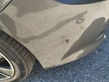 a shadow of a person on the side of a car