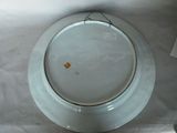 a white plate with a yellow tag on it on a table