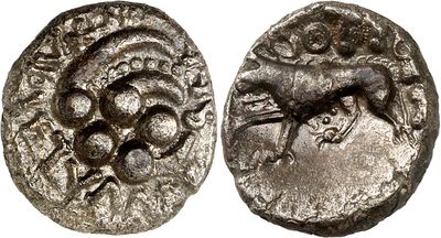 a silver coin with an image of a horse on it