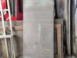 a large piece of metal sitting in the middle of a room