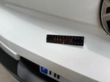 a sticker on the front of a white car