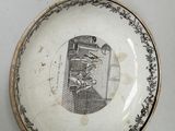 a plate with a picture of a man and a woman on it