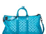 a large blue bag sitting on top of a white surface