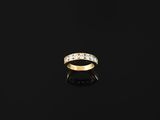 an 18k gold ring set with five round brilliant cut diamonds