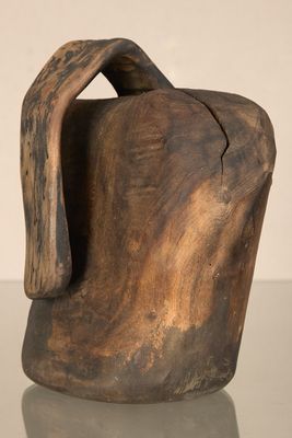 a wooden vase that is sitting on a table