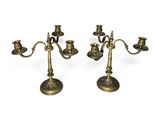a pair of antique brass candlesticks