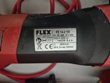 a close up of a red and black corded drill