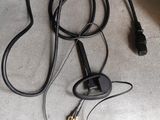 a black bag with wires attached to it sitting on the floor