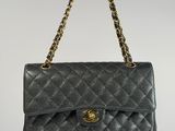 a chanel black quilted leather shoulder bag with gold hardware