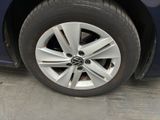 a close up of a tire on a blue car