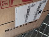 a box with a price label on it sitting on a carton