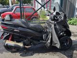 a scooter that is parked in a parking lot