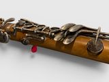 a close up of a musical instrument on a white surface