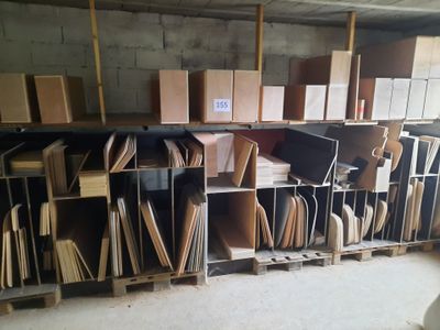 a room filled with lots of boxes and shelves