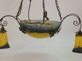 an image of a chandelier hanging from a ceiling with three glass lamps