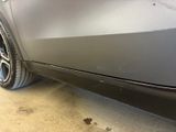 a close up of a car ' s front bumper