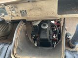 a small engine in the back of a truck