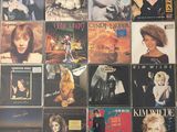 a lot of different albums on the wall