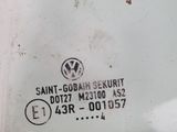 a close up of a volkswagen emblem on a white car