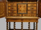 an old wooden cabinet with two doors open and a drawer on top