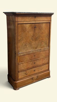 a wooden cabinet with a marble top and drawers