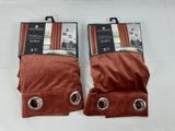 two pairs of brown velvet gloves with metal rings on them