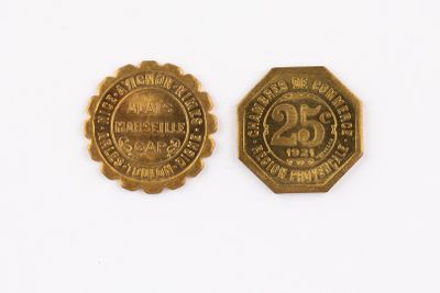 two gold coins with the date of the 20th century and the date of the 20th century