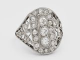 a white gold and diamond ring on a white background