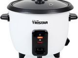 a close up of a rice cooker on a white background