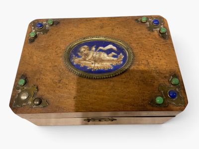 a wooden box with a blue and gold design on it