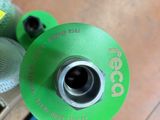 a close up view of a green and red fire hydrant