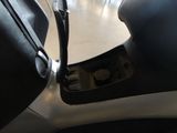 a black seat and a black bag on the floor