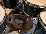 a close up view of a drum set in a recording studio