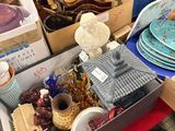 boxes of assorted items are sitting on a table in a room