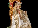 an image of a figurine of a woman sitting on a throne