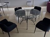 a room with a table and chairs in it