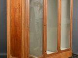 an image of a wooden display case with glass doors