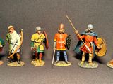 seven figurines of men dressed in medieval clothing