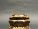 an image of a very old looking box sitting on a table