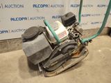 a machine that is sitting on the ground in front of a wall