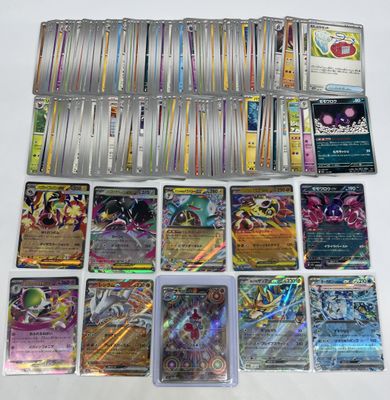 a lot of pokemon cards that are on the table
