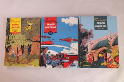 trois bandes dessinées sont alignées les unes à côté des autres sur une surface blanche